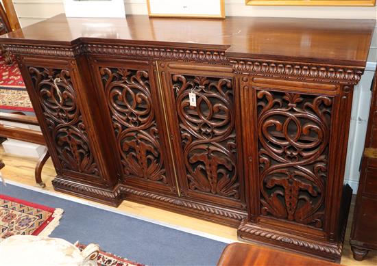 A William IV Anglo Indian carved rosewood inverse breakfront side cabinet W.190cm